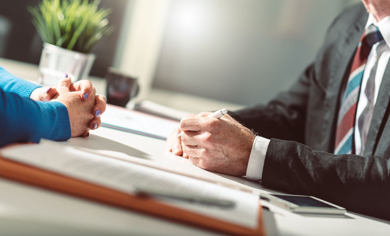 Man and woman negotiating over table